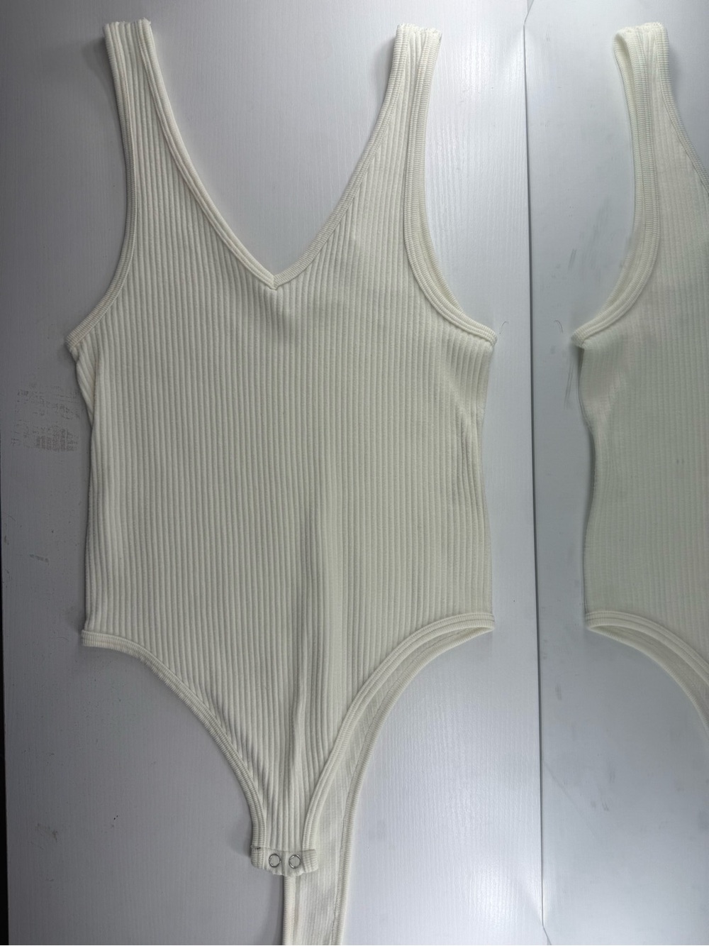 Ribbed Cream One-Piece Bodysuit